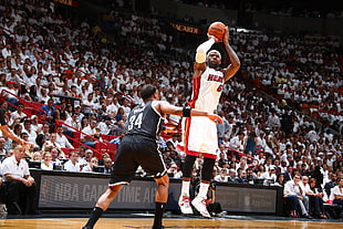 Miami Heat Lebron James 6 playing against Brooklyn Nets Paul Pierce 34
